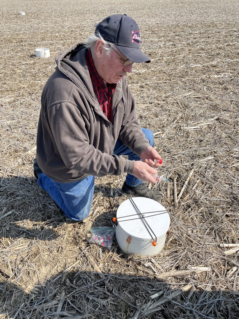 Mike Werling with the Allen County SWCD sampling the release of carbon from soil. An IUPUI project. 